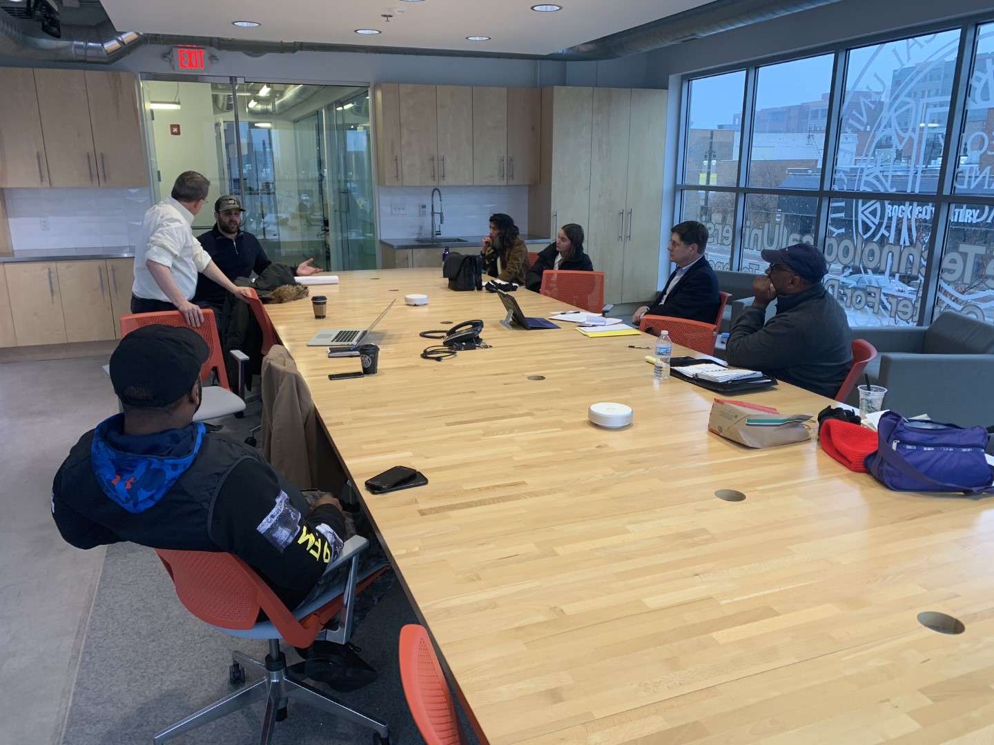 Meeting of people at a desk