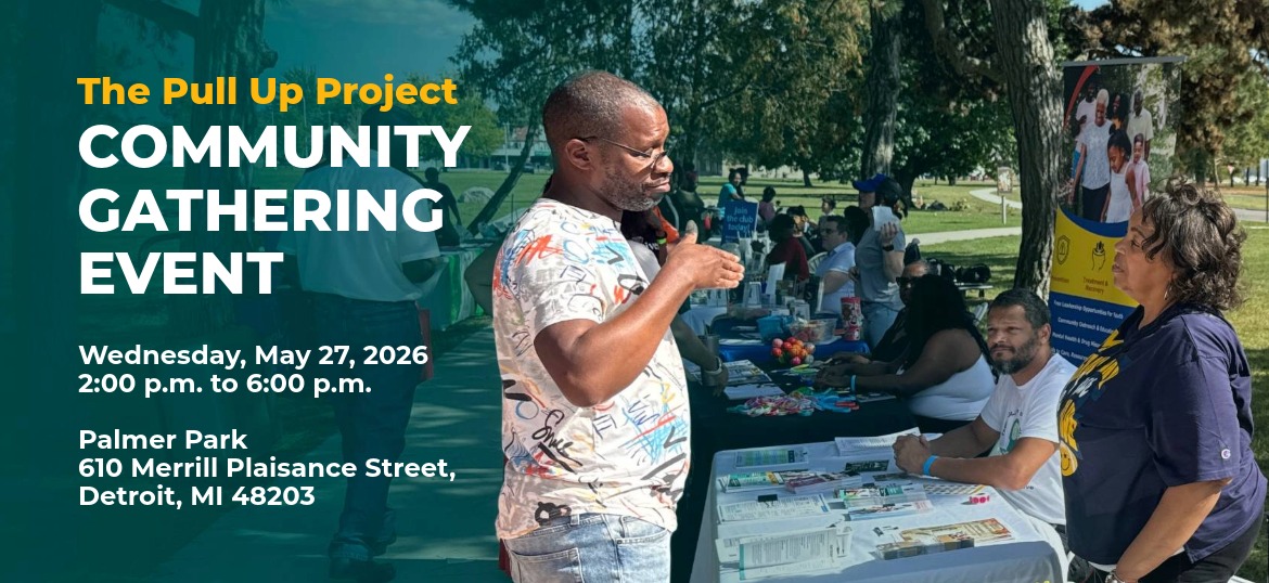 Image of a Detroiter talking to someone in a resource table